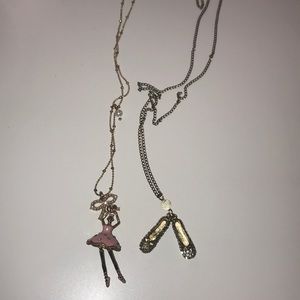 Ballerina and ballet shoe necklaces.